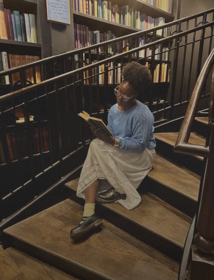 Reader on library stairs