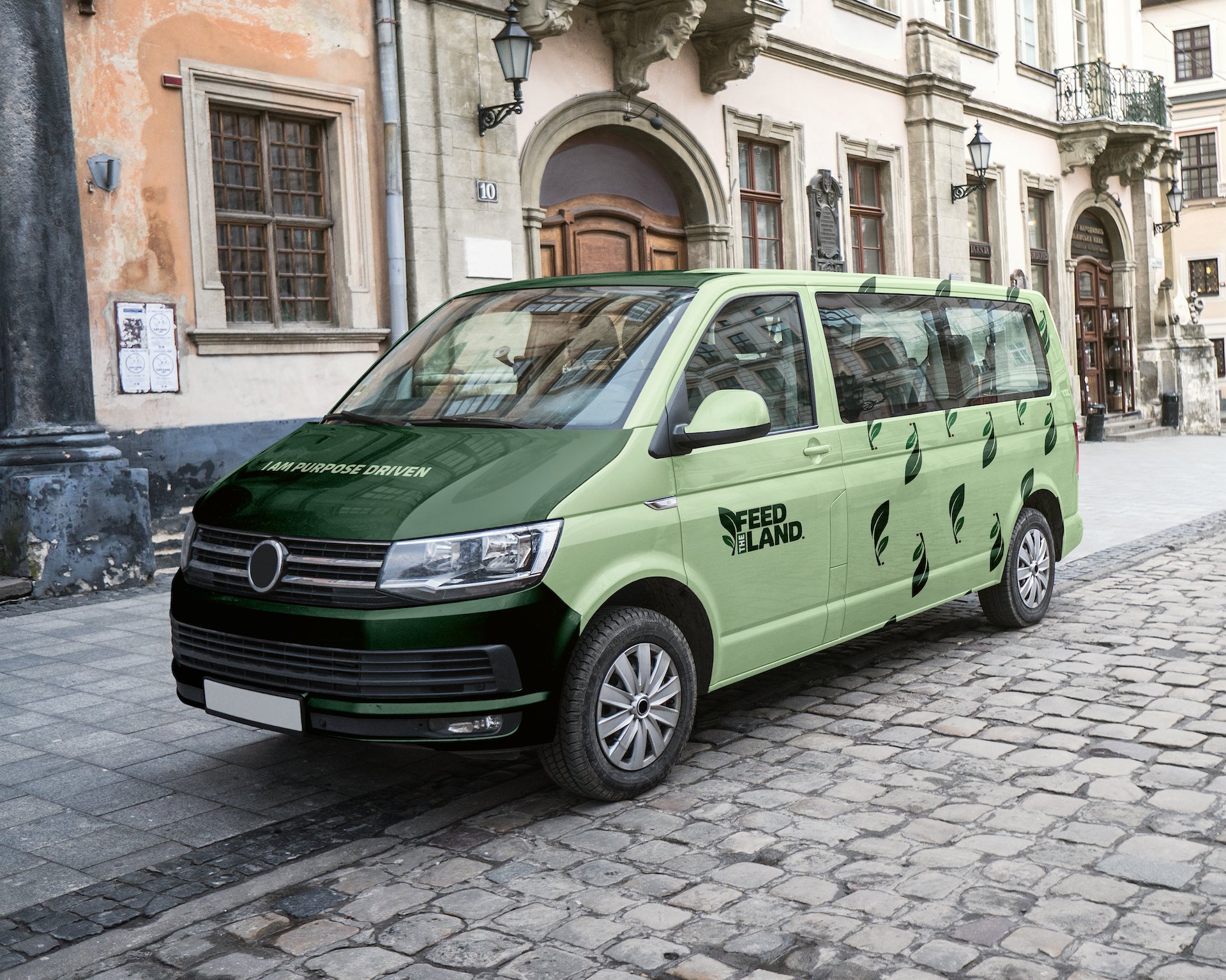 Feed The Land branded van on a cobbled street